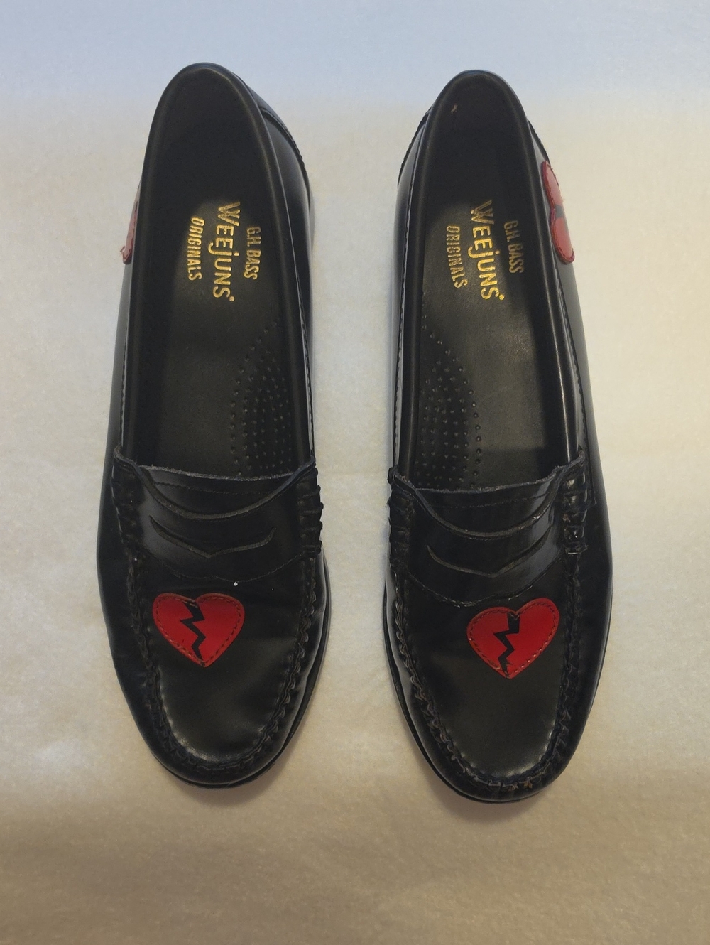 G.H. Bass & Co. Black Leather Penny Loafers with Red Broken‑Heart Patch